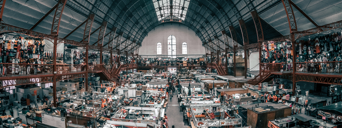 Wide view of busy warehouse and stalls