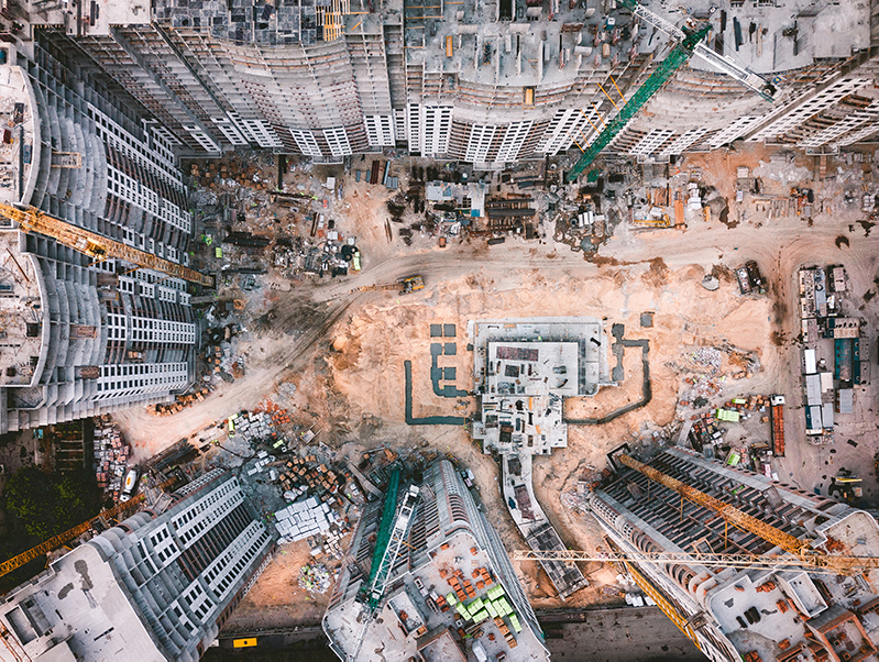 Aerial view of a construction site and high-rise buildings