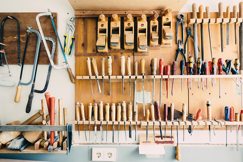 Tools hung on neatly on the wall of a workshop